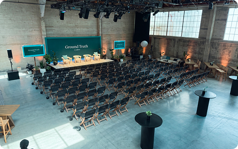 The Ground Truth venue, a Dogpatch event space set with rows of chairs and a stage.